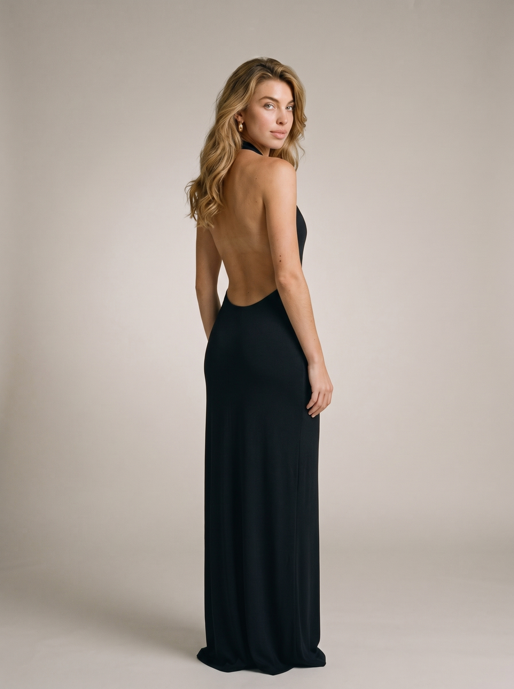Flora — Split Backless Halter Neck Maxi Dress, back view, glancing over shoulder